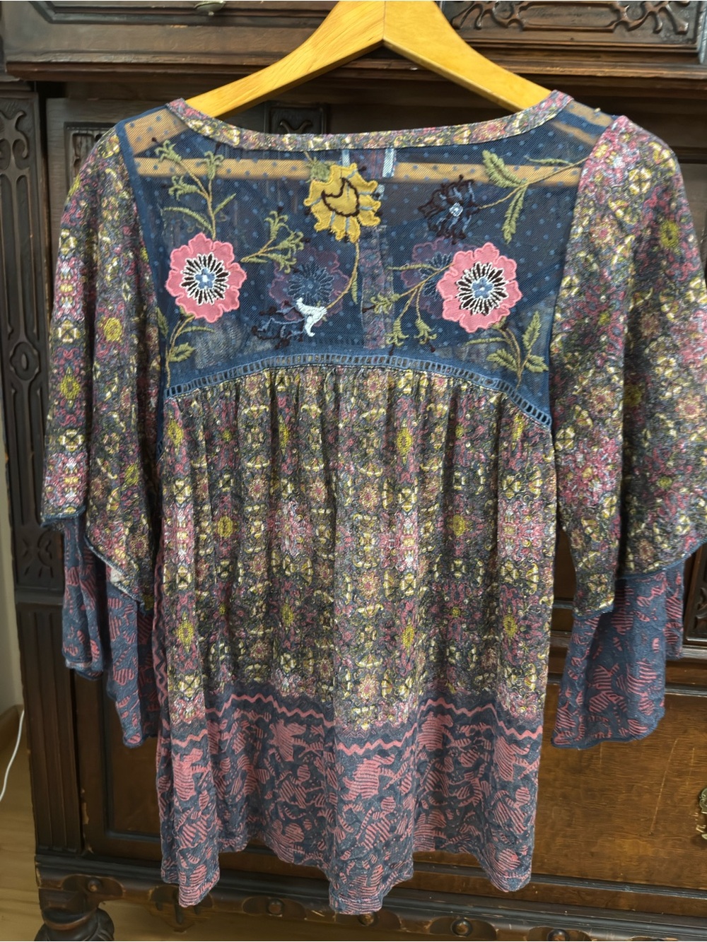 Lovely women’s top with intricate floral details.